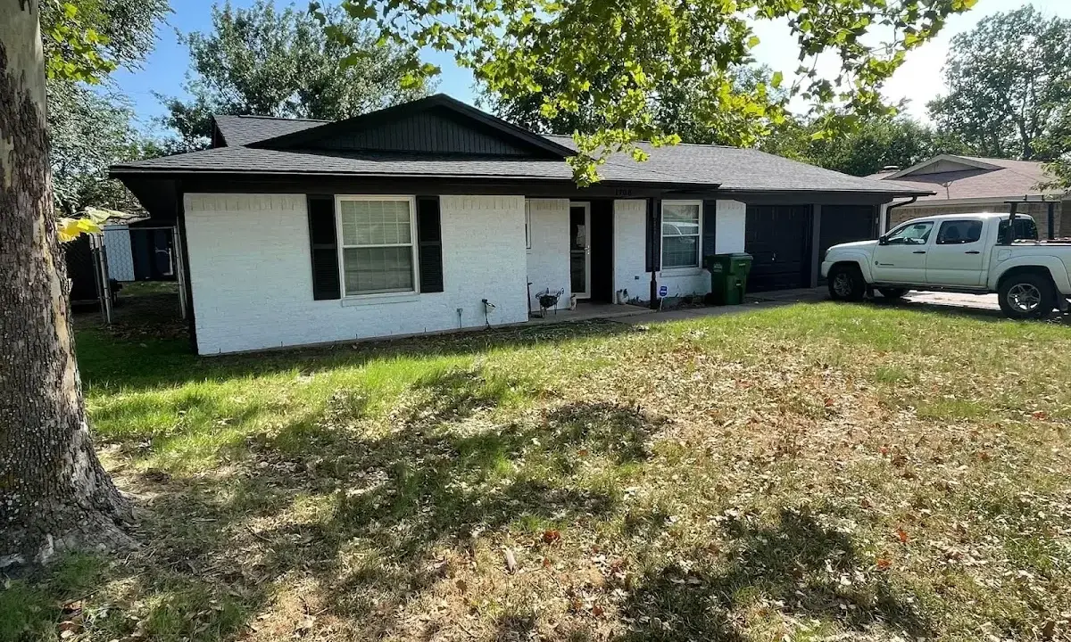 Professional roofing crew working on a residential roof in Rapid Valley